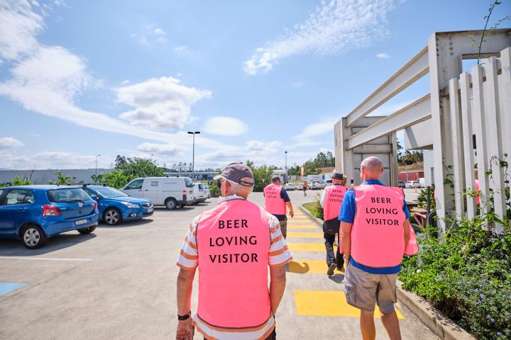 a group of people standing in a parking lot