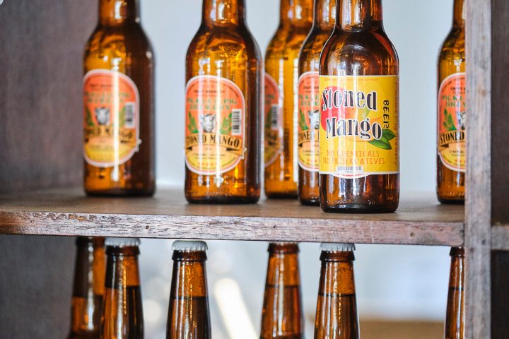 a bottle of wine and a glass of beer on a table