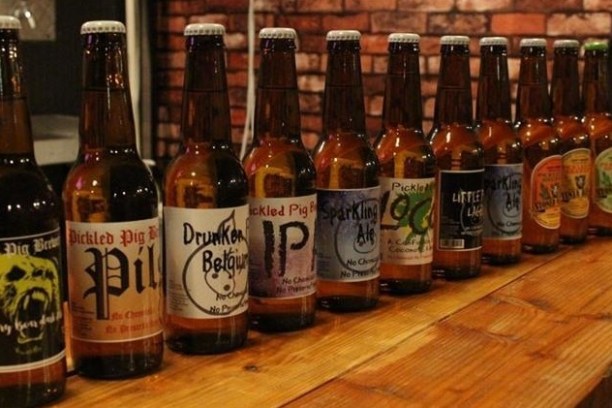 a bottle of wine sitting on top of a wooden table