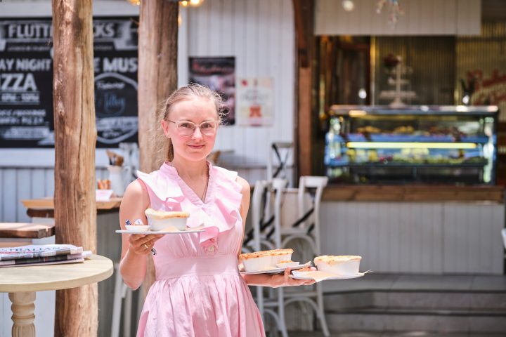 a woman standing in front of a building