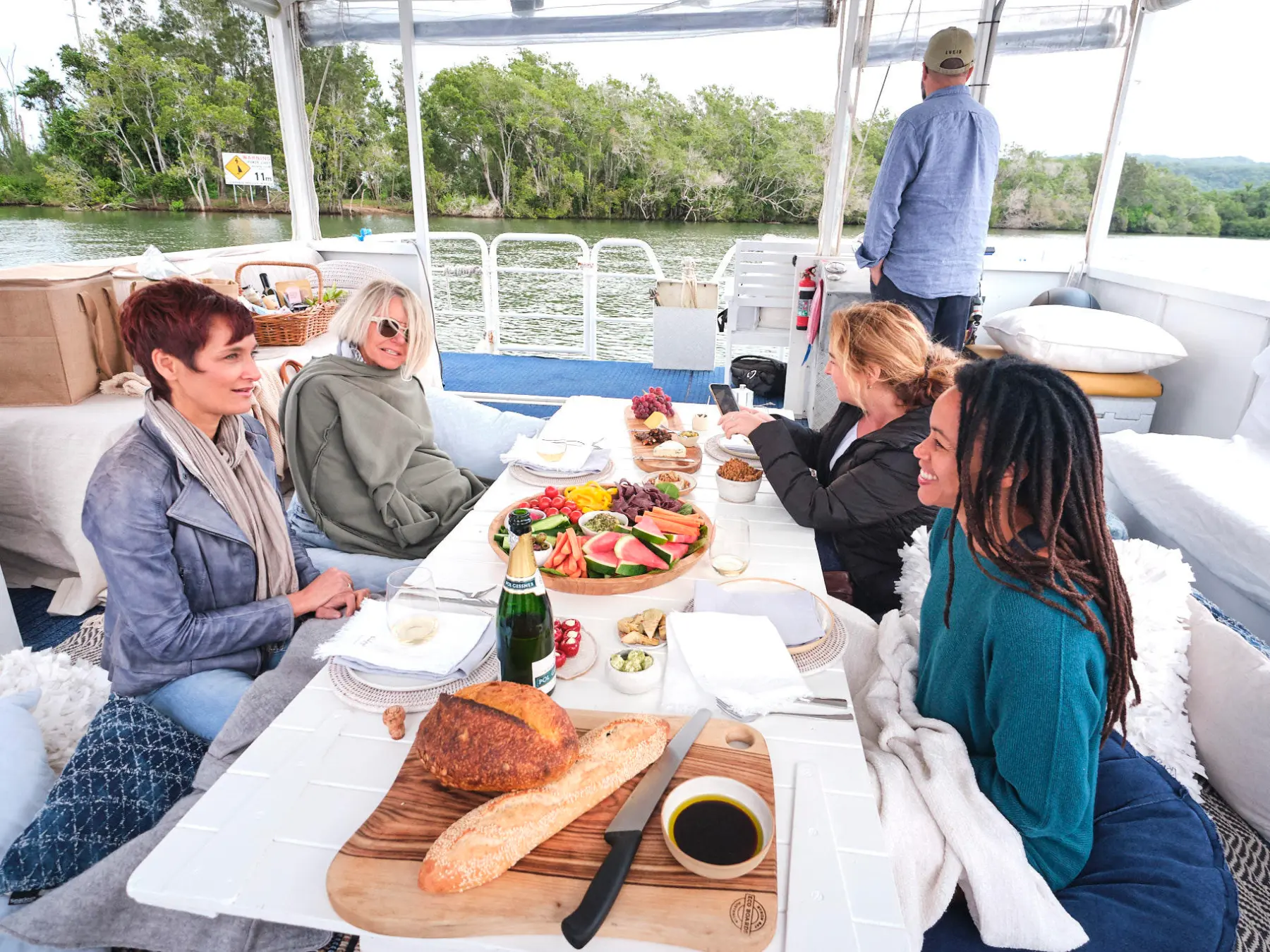 a group of people sitting at a picnic table