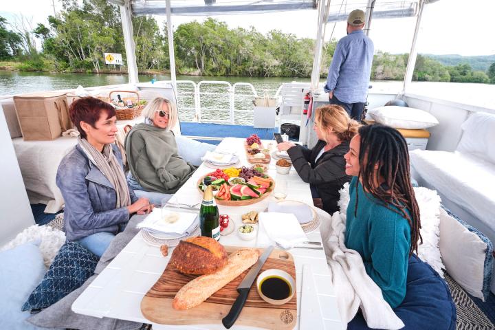 a group of people sitting at a picnic table