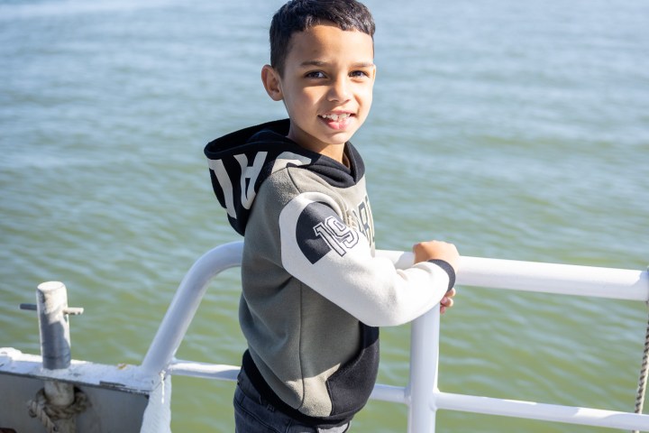 a person sitting on a boat in a body of water
