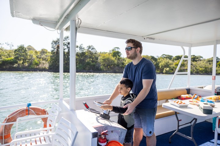 a person standing in front of a boat
