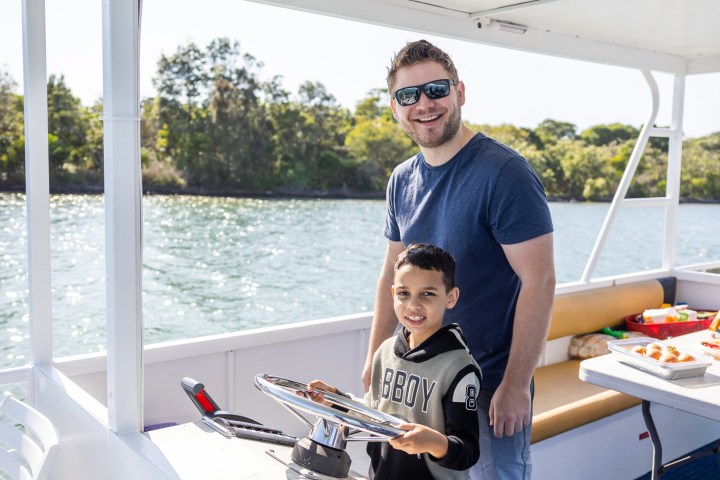 a man standing in front of a window