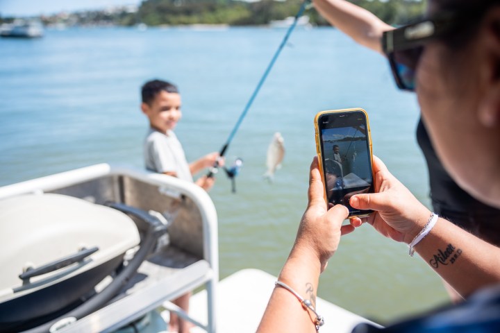 a person sitting on a boat in the water