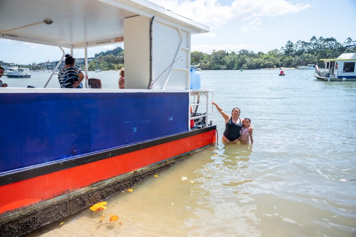 a group of people on a boat in the water