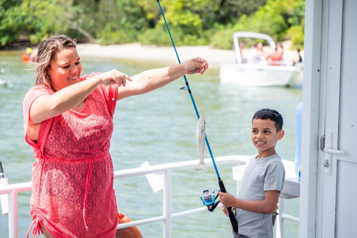 a person standing in front of water