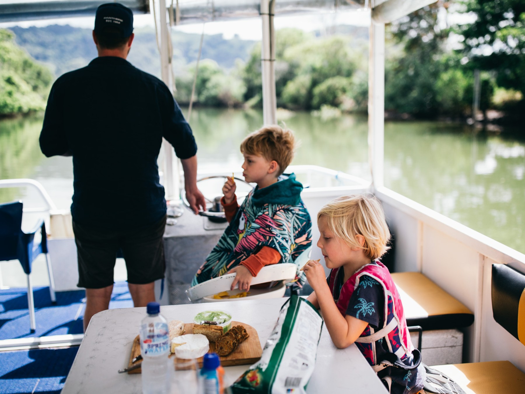 a young boy sitting at a table