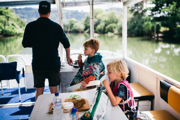 a young boy sitting at a table