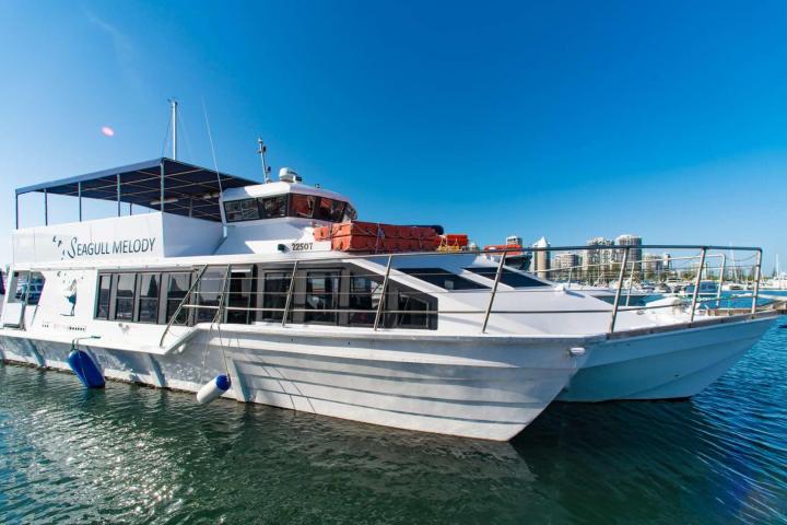 a boat is docked next to a body of water