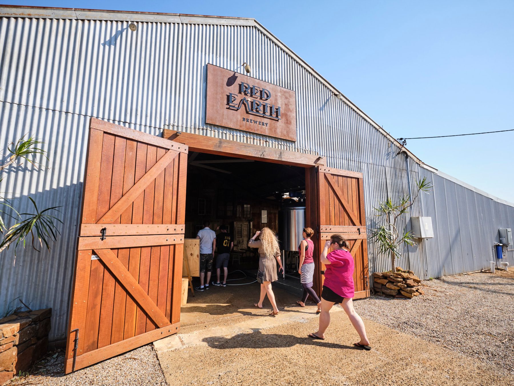 a person standing in front of a fence