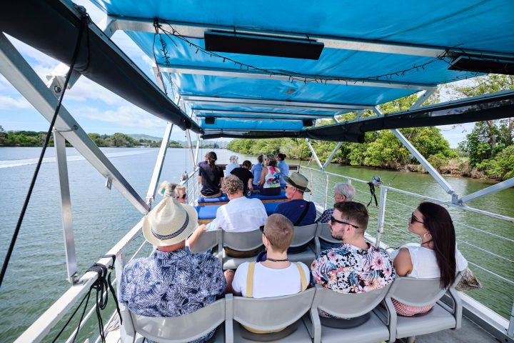 a group of people in a boat on a body of water