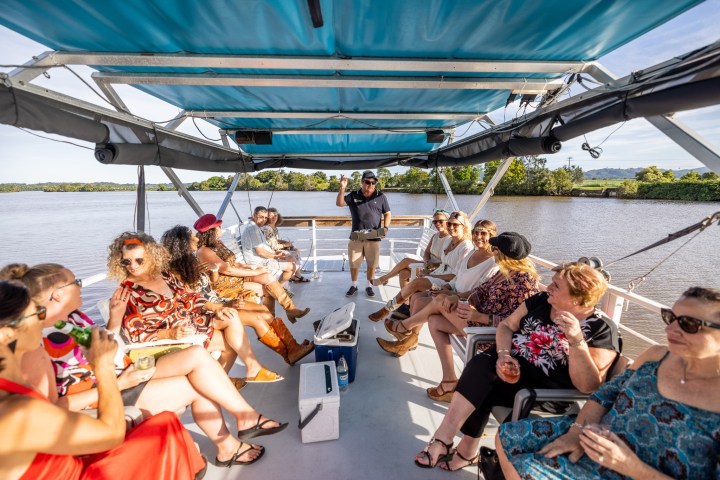 a group of people sitting on a boat