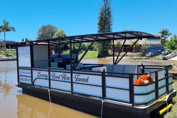 a truck is parked on the side of a river