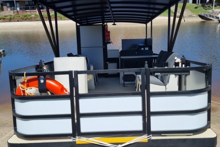 a boat sitting on top of a wooden chair