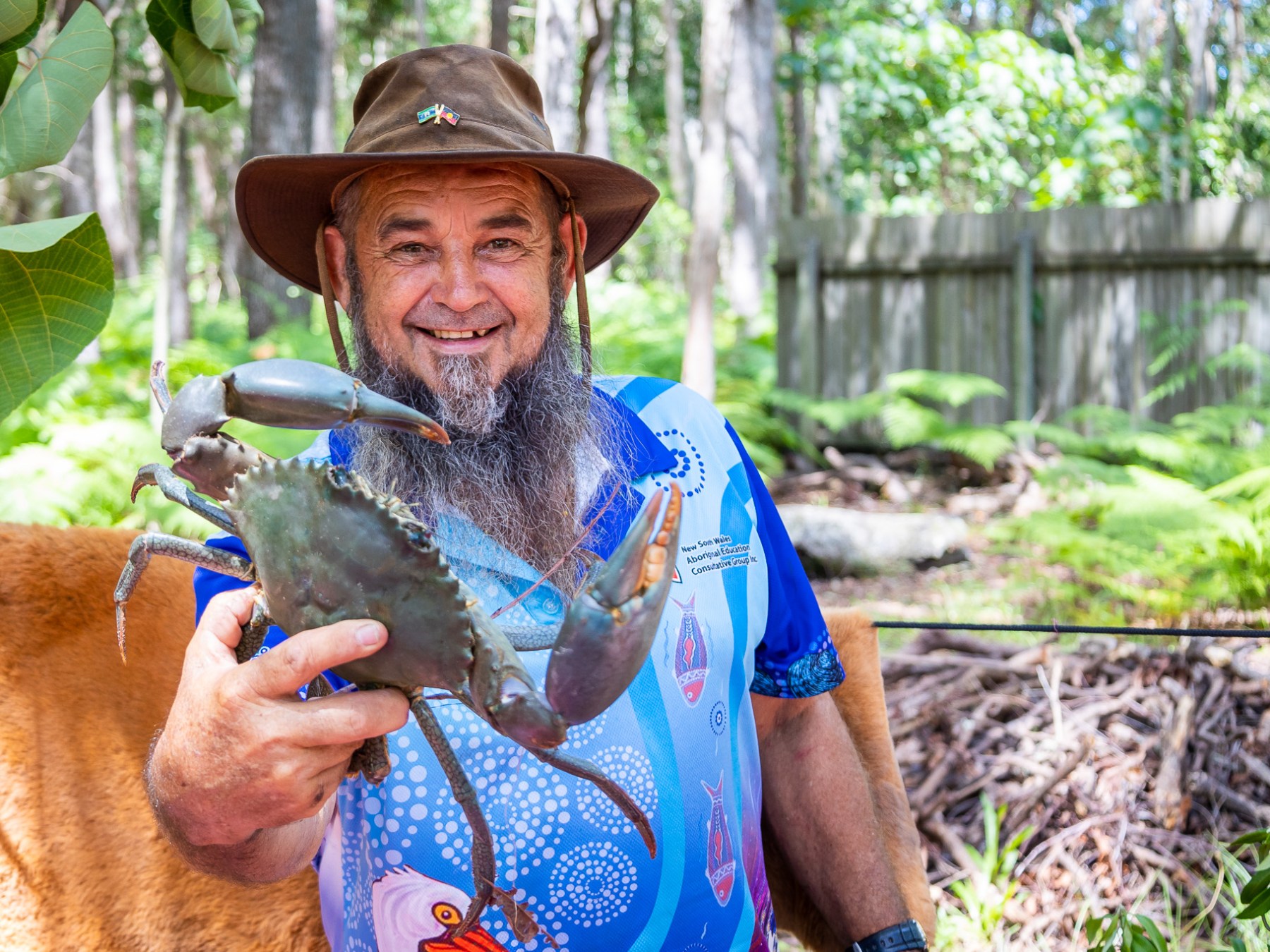 a man holding an animal