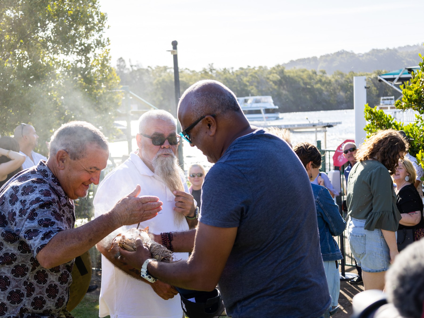 a group of people around each other