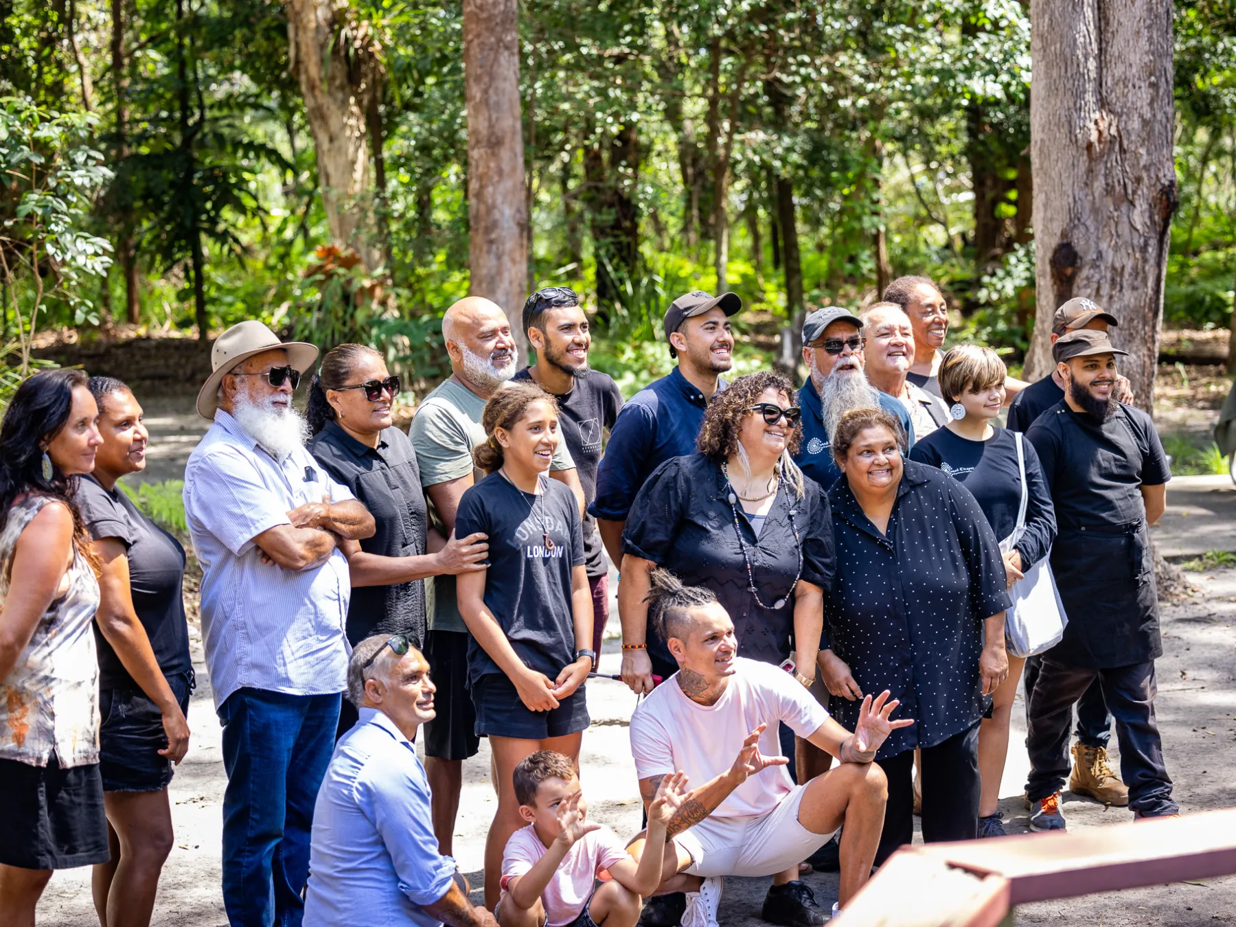 a group of people in a forest
